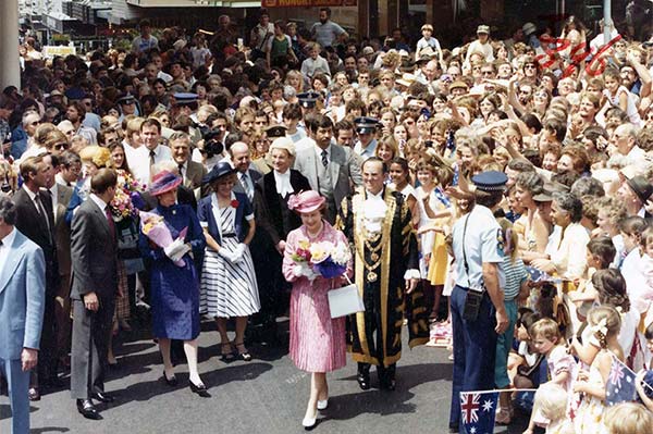 Her Majesty Queen Elizabeth II escorted by Brisbane Lord Mayor Alderman Roy Harvey along Queen St Mall, Brisbane, 7 October 1982.